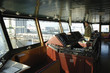 skipper standing inside ships bridge