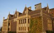 gable roof, chimney pots, & tudor style windows