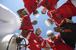 Photo: Football Players and Coach in Huddle, view from below, view from below Football Players and Coach in Huddle, view from below, view from below
