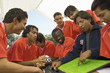 Photo: Coach explaining play to soccer team Coach explaining play to soccer team