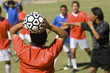 Photo: Soccer player throwing in ball, back view Soccer player throwing in ball, back view