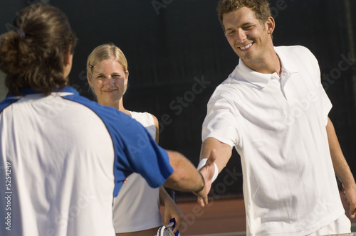 Photo: Tennis Players Shaking Hands at Net Tennis Players Shaking Hands at Net