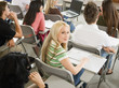 Student sitting at desk during class, portrait