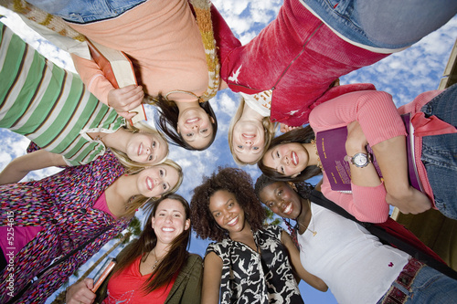 Photo: Ring of female friends outdoors, portrait Ring of female friends outdoors, portrait