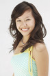 Young woman smiling in studio, portrait