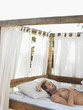Man on Bed Outside