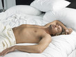 Man Asleep on Bed