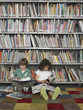 Elementary Student Reading in Library