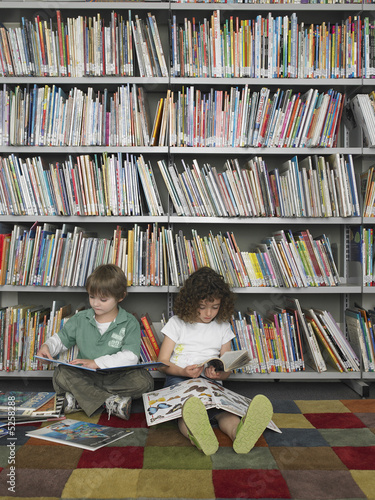 Elementary Student Reading in Library