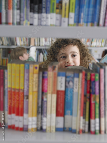 Photo: Elementary Student Reading in Library Elementary Student Reading in Library