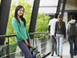 Young Woman Leaning Against a Railing