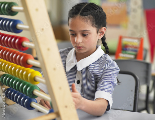 Photo: Schoolgirl Using an Abacus Schoolgirl Using an Abacus