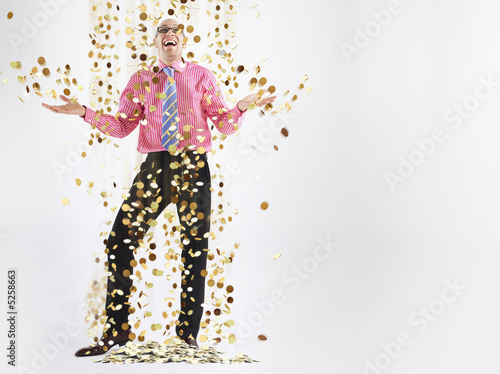 Photo: Businessman Being Showered in Money Businessman Being Showered in Money