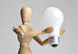 Mannequin holding a light bulb Mannequin holding a light bulb