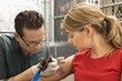 Woman getting tattoo.