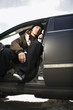 Photo: Teen sitting in car. Teen sitting in car.