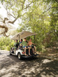 Family in golf cart.