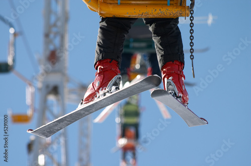 Photo: skier on chair lift skier on chair lift