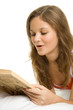 Girl reading book in bed Girl reading book in bed