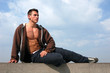 Sitting Muscular Man