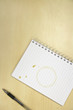 Coffee Ring on Notebook on desk, overhead view