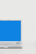 Open laptop on desk, cropped