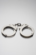 Handcuffs on white background in studio