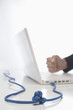Foto: Knotted Cord Attached to Laptop Knotted Cord Attached to Laptop