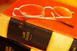 Closeup of eye glasses on top of legal books
