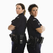Policewomen back to back.