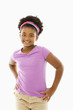 Foto: African American girl with hands on hips smiling at viewer. African American girl with hands on hips smiling at viewer.