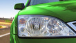 Green car on the road