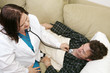 home health nurse using stethoscope 
