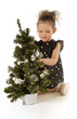 The little girl with a Christmas tree The little girl with a Christmas tree