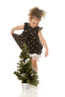 The little girl with a Christmas tree The little girl with a Christmas tree