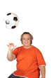 Soccer fan throwing the a football forward