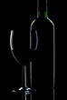 Low key shot of wine bottle and glass