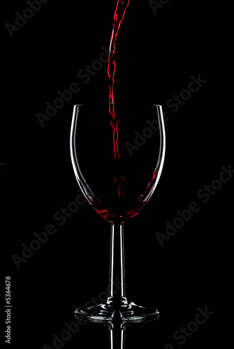 Red wine being poured into a glass