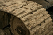 Detail of the caterpillar track of a heavy construction machine.
