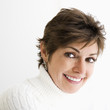 Photo: Head and shoulder portrait of Caucasian woman smiling. Head and shoulder portrait of Caucasian woman smiling.