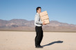 Businessman carrying heavy boxes Businessman carrying heavy boxes