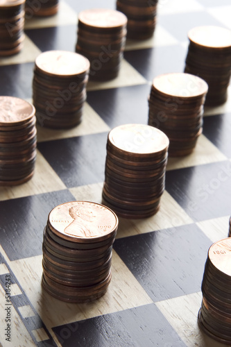 Photo: Chessboard with stacks of pennies Chessboard with stacks of pennies