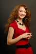 The beautiful girl in a red dress