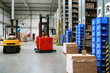 Busy warehouse with pallet trucks working