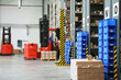 Busy warehouse with pallet trucks working