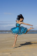 Pretty girl jumping wearing a puffy blue dress Pretty girl jumping wearing a puffy blue dress