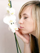 Close up of beautiful woman with white orchid
