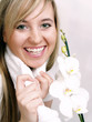 Close up of beautiful woman with white orchid