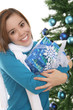 A pretty girl at Christmas holding her presents A pretty girl at Christmas holding her presents