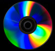 There is colored CD on black background There is colored CD on black background